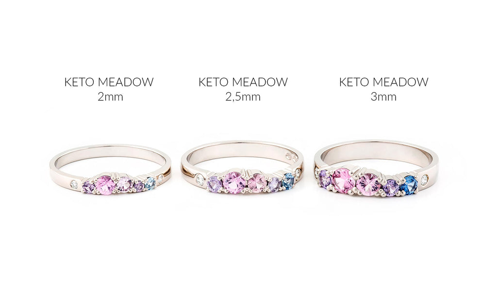 Keto Meadow 2mm, 2,5mm and 3mm rings side by side. The rings have pink, purple and blue sapphires and white tw/vs diamonds. Design by Jussi Louesalmi, Au3 Goldsmiths.