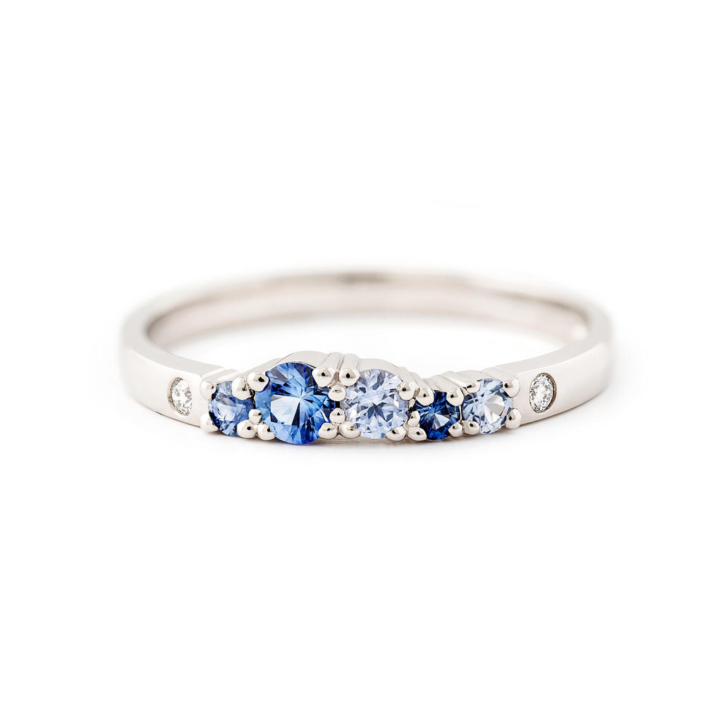 Narrow 2mm wide Keto Meadow ring in 750 white gold with blue sapphires and white tw/vs diamonds. Design by Jussi Louesalmi, Au3 Goldsmiths.