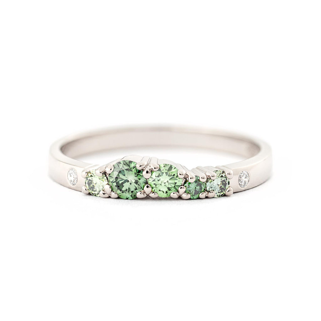 2mm wide Keto Meadow ring in 750 white gold with treated green diamonds and white tw/vs diamonds. Design by Jussi Louesalmi, Au3 Goldsmiths.