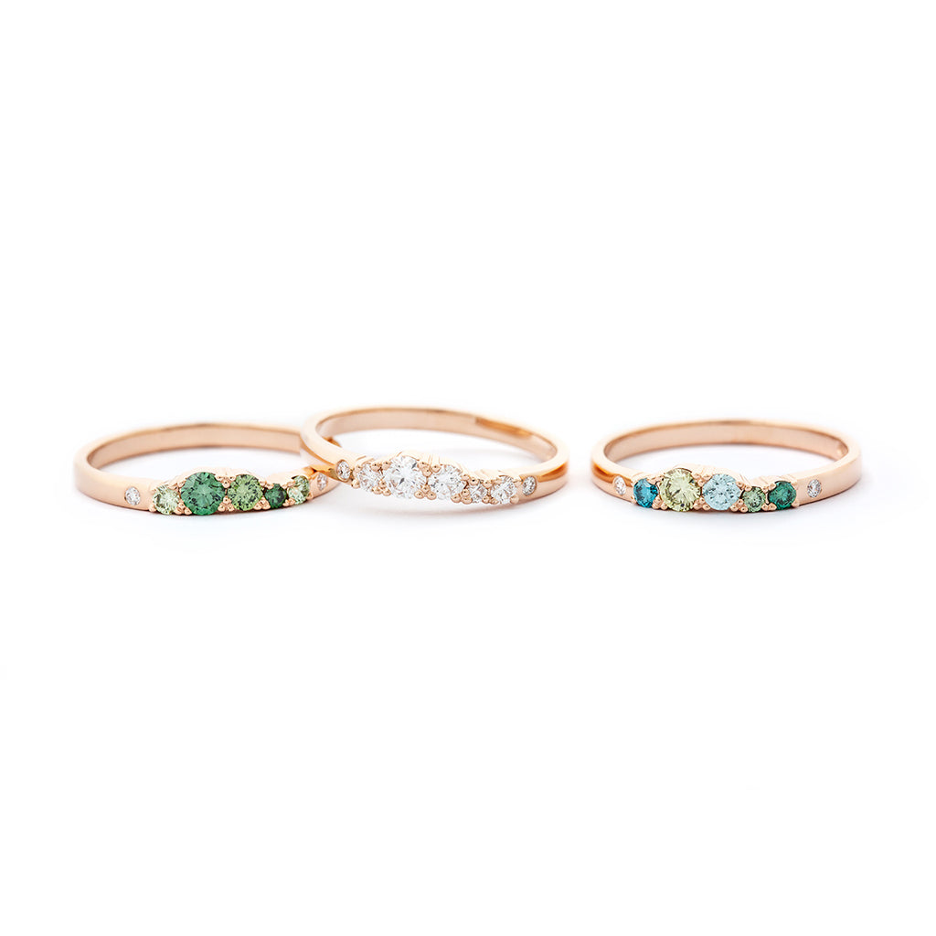 Narrow 2mm wide Keto Meadow rings in 750 gold with green, turquoise, and white tw/vs diamonds. Design by Jussi Louesalmi, Au3 Goldsmiths.
