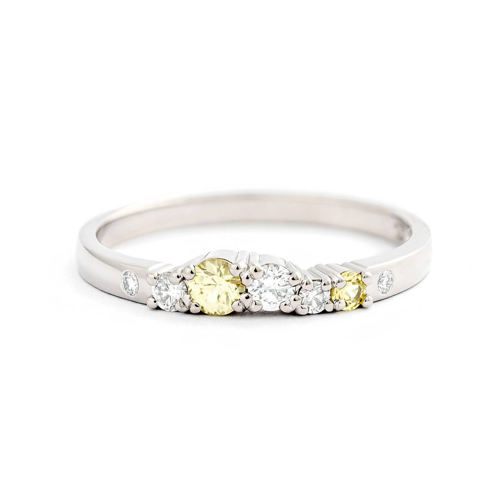 Pastel yellow sapphires and white tw/vs diamonds in a 2mm wide Keto Meadow Spring collections white gold ring. Design by Jussi Louesalmi, Au3 Goldsmiths.
