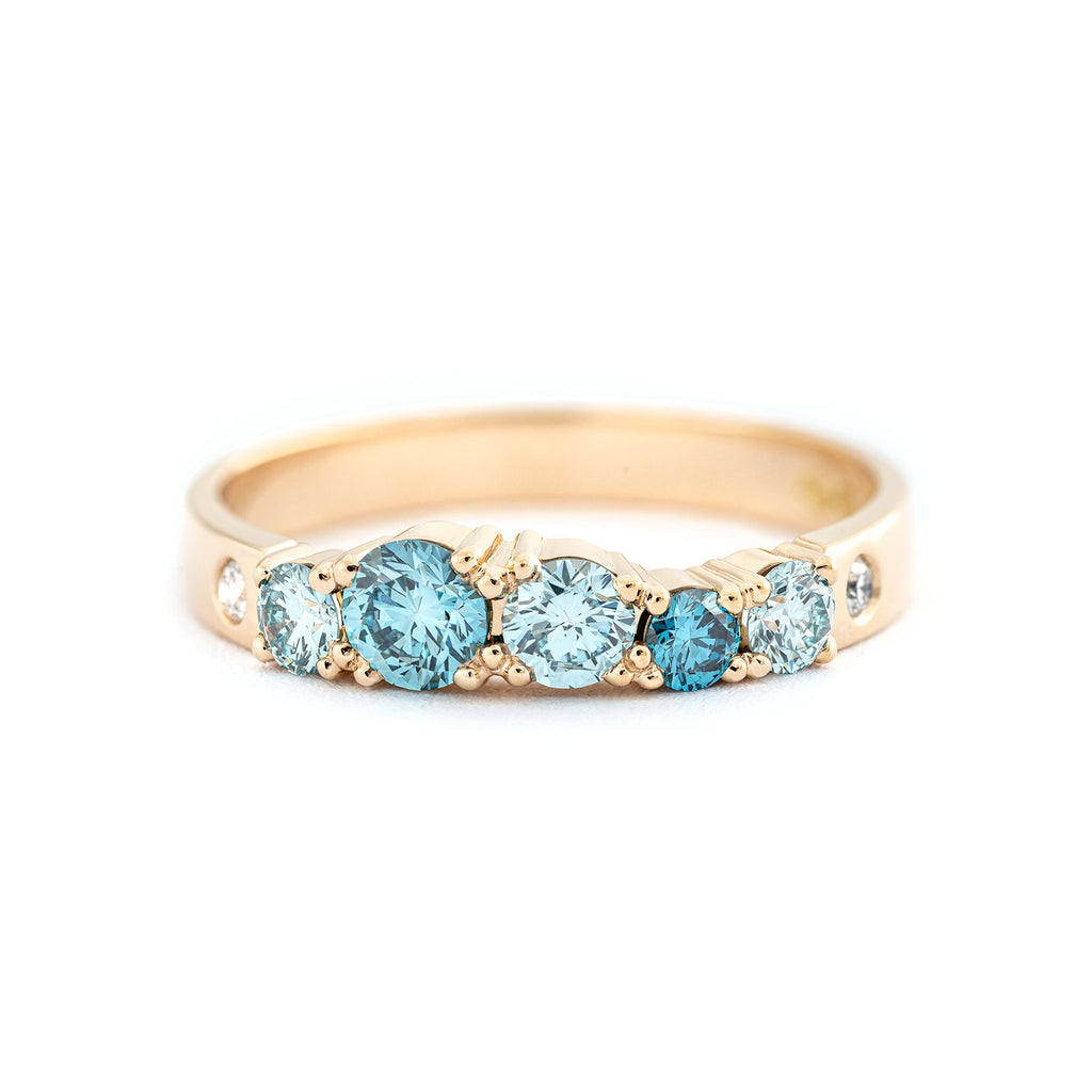 Glowing Keto Meadow ring in 750 yellow gold with turquoise diamonds and white tw/vs diamond. Design by Jussi Louesalmi, Au3 Goldsmiths.