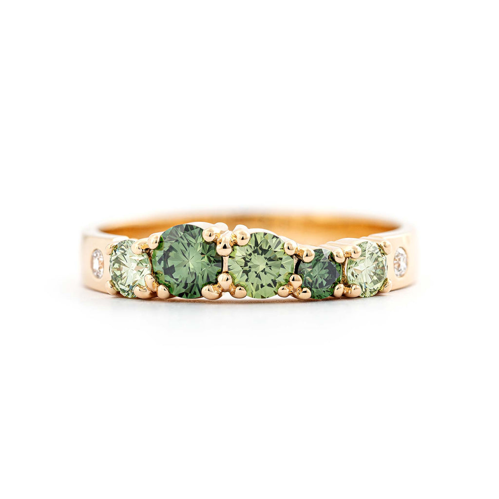 Vivid 3mm wide Keto Meadow ring in 750 yellow gold with different size treated color green diamonds and white tw/vs diamonds. Design by Jussi Louesalmi, Au3 Goldsmiths. 