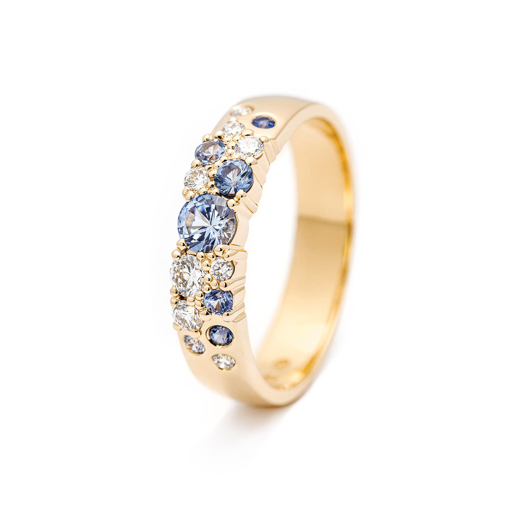 Keto Meadow Spring Collection's 4mm wide ring in 750 yellow gold, with pastel blue sapphires and white tw/vs diamonds, design by Jussi Louesalmi, Au3 Goldsmiths.