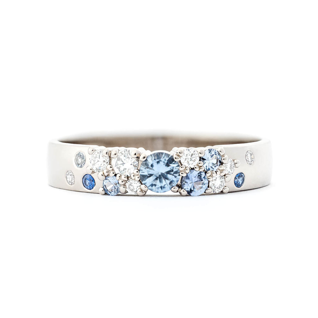 Keto Meadow Spring collections 4mm wide ring, with pastel blue sapphires. Design by Jussi Louesalmi Au3 Goldsmiths.