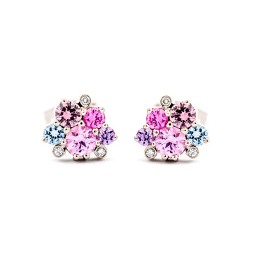 A pair of Keto Meadow stud earrings in 750 white gold., both with 5 colorful sapphires and 3 white tw/vs diamonds. Design by Jussi Louesalmi, Au3 Goldsmiths.
