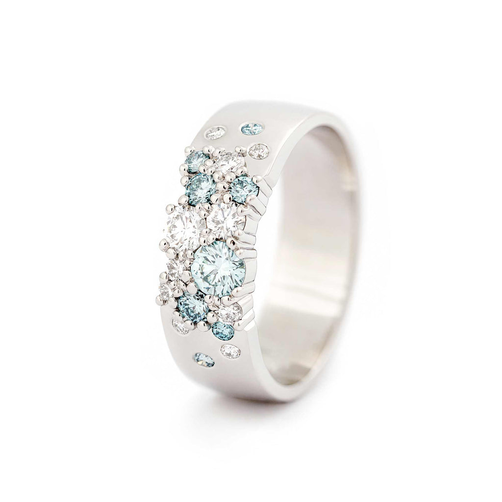 Keto Meadow 6mm wide ring in 750 white gold with Ice blue diamonds and white tw/vs diamonds. Design by Jussi Louesalmi, Au3 Goldsmiths.