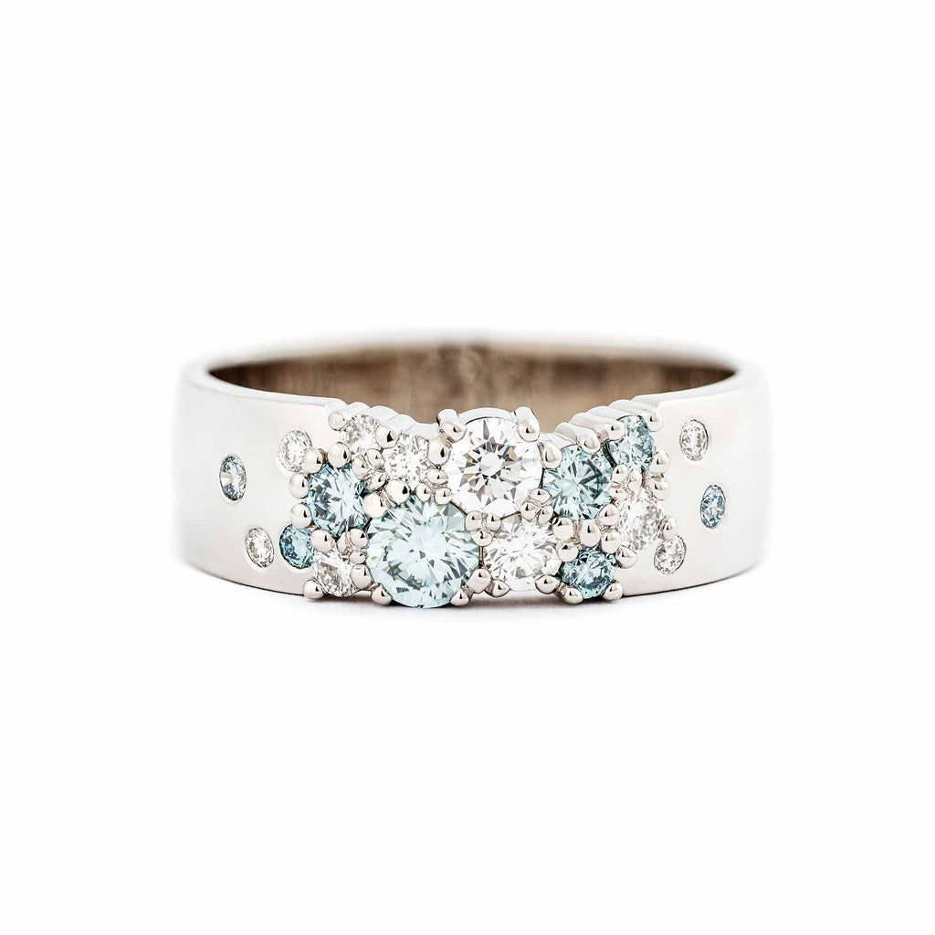 Keto Meadow 6mm wide ring in 750 white gold with Ice blue diamonds and white tw/vs diamonds. Design by Jussi Louesalmi, Au3 Goldsmiths.