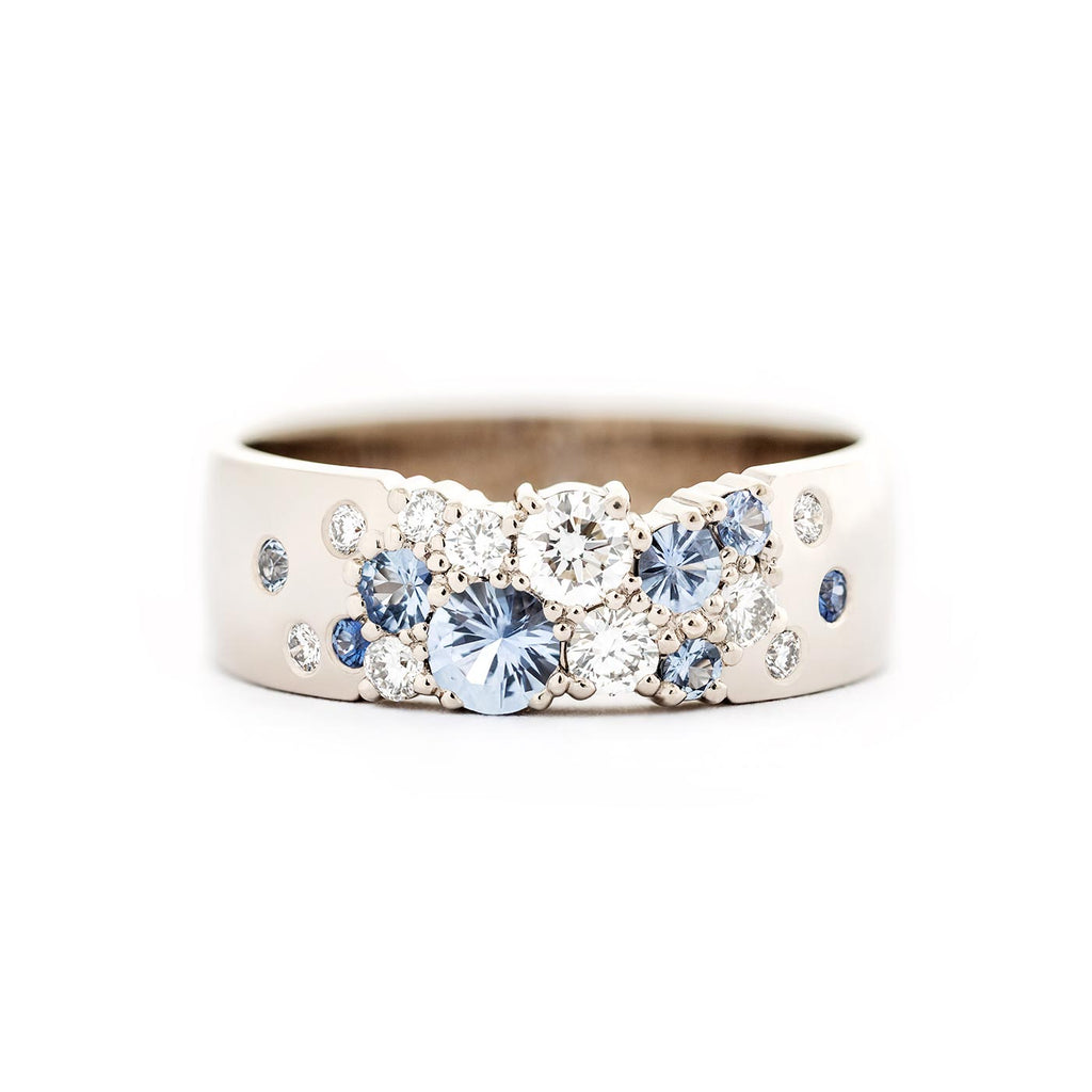 Keto Meadow Spring collection's 6mm wide ring with pastel blue sapphires and white tw/vs diamonds. Design by Jussi Louesalmi, Au3 Goldsmiths.