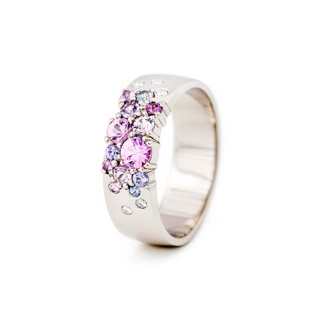 The winner of The Most Beautiful Ring of the Year competition! Keto Meadow 6mm wide ring in 750 white gold, with pink, purple and blue sapphires and white tw/vs diamonds. Design by Jussi Louesalmi, Au3 Goldsmiths.