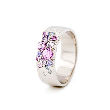 The winner of The Most Beautiful Ring of the Year competition! Keto Meadow 6mm wide ring in 750 white gold, with pink, purple and blue sapphires and white tw/vs diamonds. Design by Jussi Louesalmi, Au3 Goldsmiths.