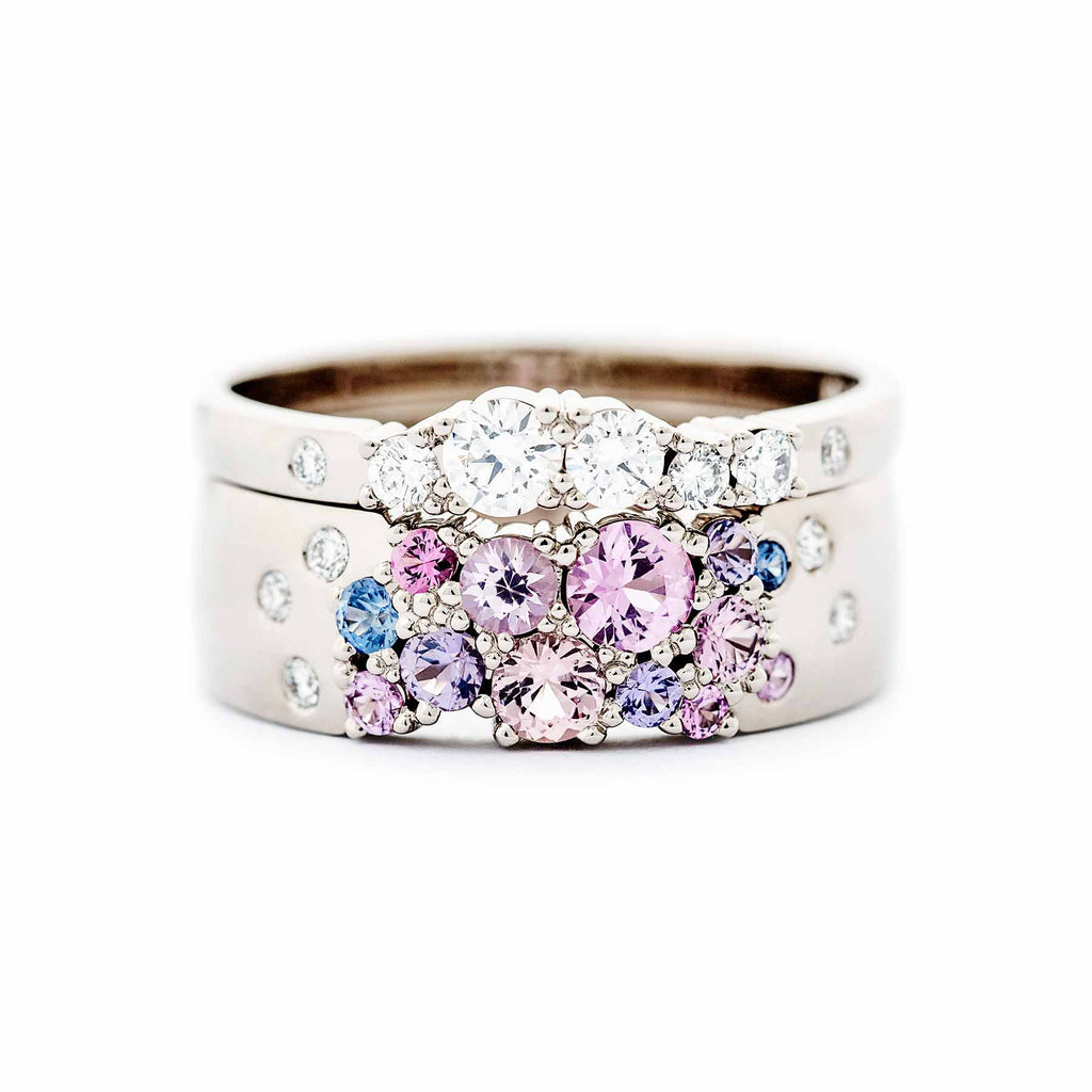 6mm wide Keto Meadow ring with pink, purple and blue sapphires and white tw/vs diamonds together with 2mm wide Keto Meadow ring with white tw/vs diamonds. Design by Jussi Louesalmi, Au3 Goldsmiths.