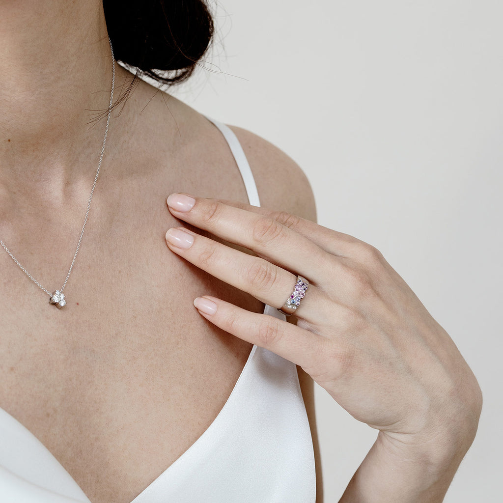 Model wearing the 6mm wide Keto Meadow white gold ring on finger. Design by Jussi Louesalmi, Au3 Goldsmiths.