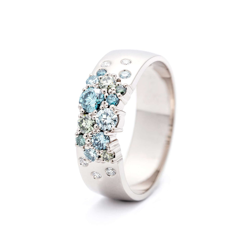 Keto Meadow 6mm wide ring in 750 white gold, with turquoise diamonds and white tw/vs diamonds. Design by Jussi Louesalmi, Au3 Goldsmiths. 