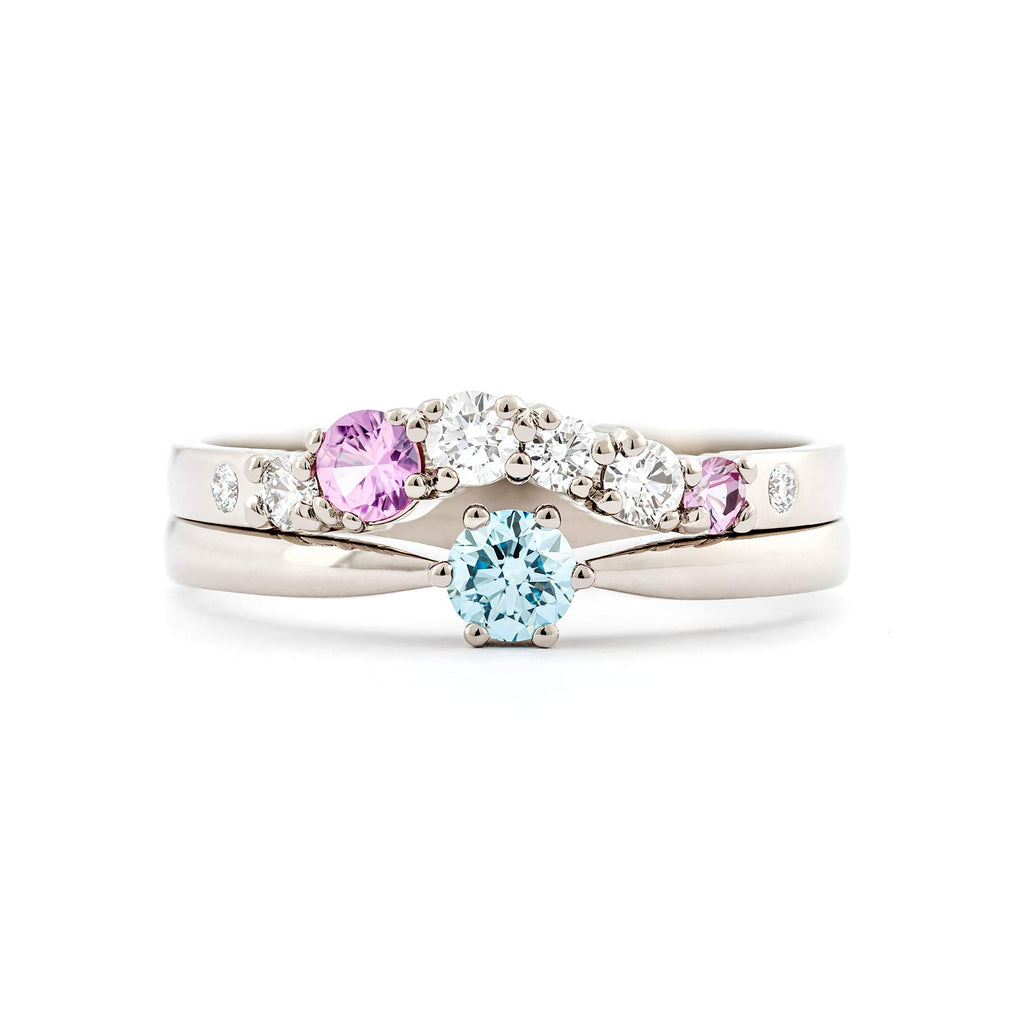 Curvy Keto Meadow Arc+ ring with 2 pink sapphires and 6 white diamonds, on top of a Keto Meadow ONE ring with turquoise diamond, design by Jussi Louesalmi, Au3 Goldsmiths