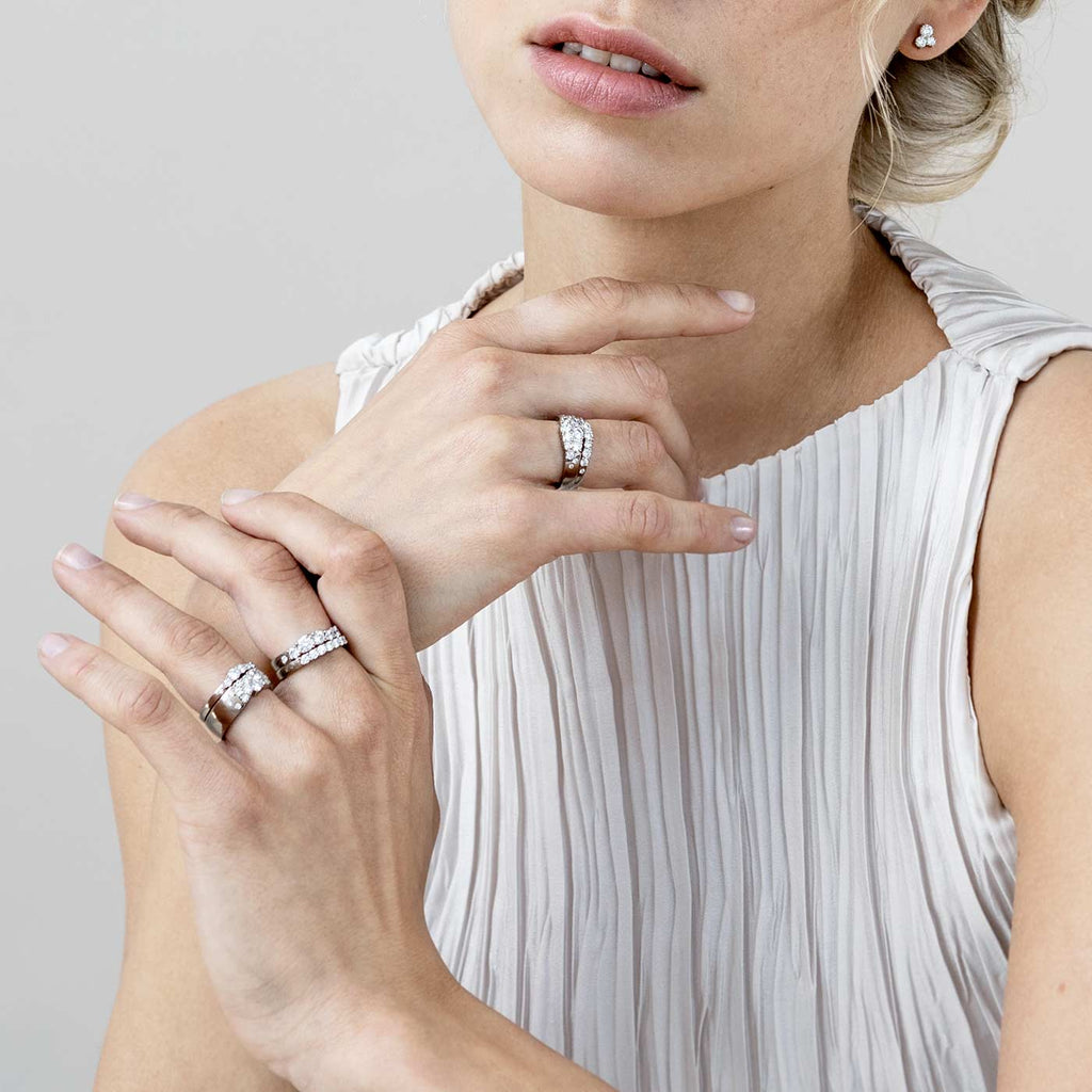 Model wearing Keto Meadow diamond rings, design by Jussi Louesalmi, AU3 Goldsmiths.