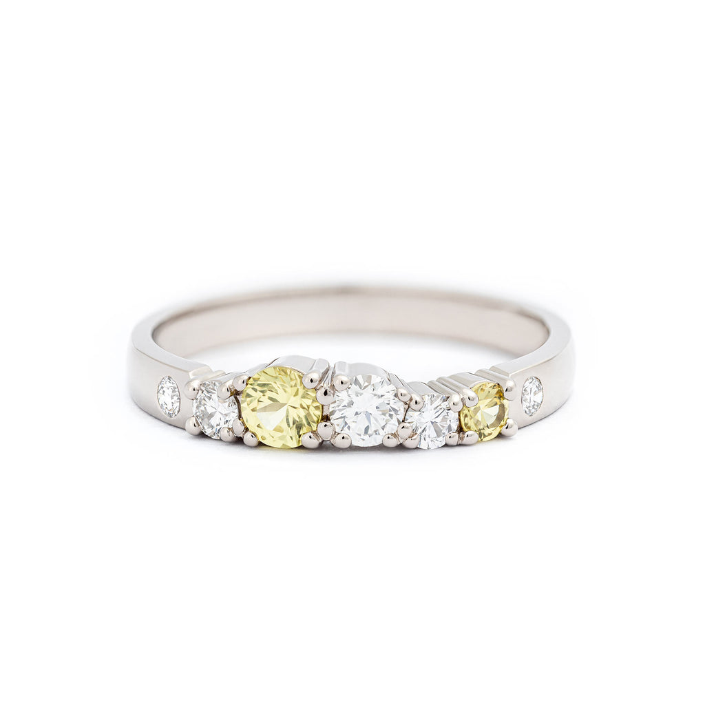 Keto Meadow Spring collections 2,5mm ring in 750 white gold, with 2 yellow sapphires and 5 white diamonds. Design by Jussi Louesalmi, Au3 Goldsmiths.