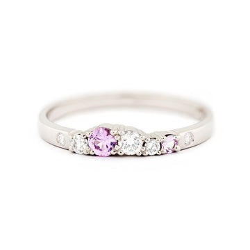 Pastel pink sapphires and white tw/vs diamonds in a narrow Keto Meadow spring collections ring in 750 white gold. Design by Jussi Louesalmi, Au3 Goldsmiths.
