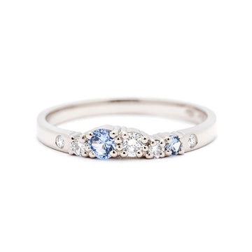 Pastel blue sapphires and white diamonds in a 2mm wide narrow Keto Meadow ring. Made in 750 white gold. Design by Jussi Louesalmi, Au3 Goldsmiths