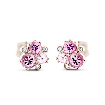 A pair of Keto Meadow stud earrings, both with 3 pink sapphires and 3 white tw/vs diamonds. Design by Jussi Louesalmi, Au3 Goldsmiths.