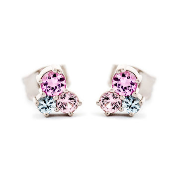 A pair of cute stud earrings, both with 3 different size colorful sapphires. Design by Jussi Louesalmi, Au3 Goldsmiths.