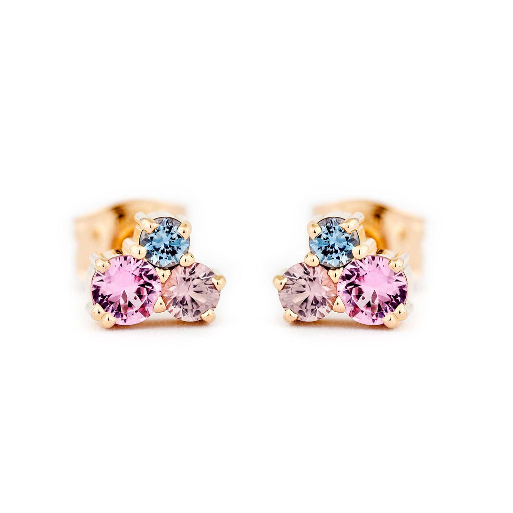 A pair of stud earrings in 750 yellow gold, both earrings with 3 different size colorful sapphires. Design by Jussi Louesalmi, Au3 Goldsmiths.