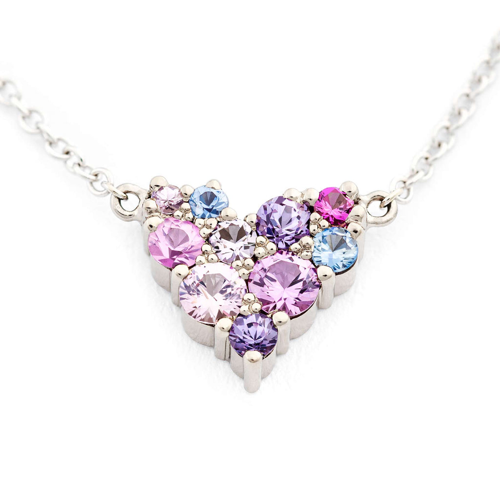 Cute Keto Meadow Heart shaped necklace filled with different size colorful sapphires. Design by Jussi Louesalmi, Au3 Goldsmiths