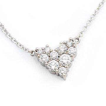 Keto Meadow necklace with different size white tw/vs diamonds in a shape of a heart. Design by Jussi Louesalmi, Au3 Goldsmiths.