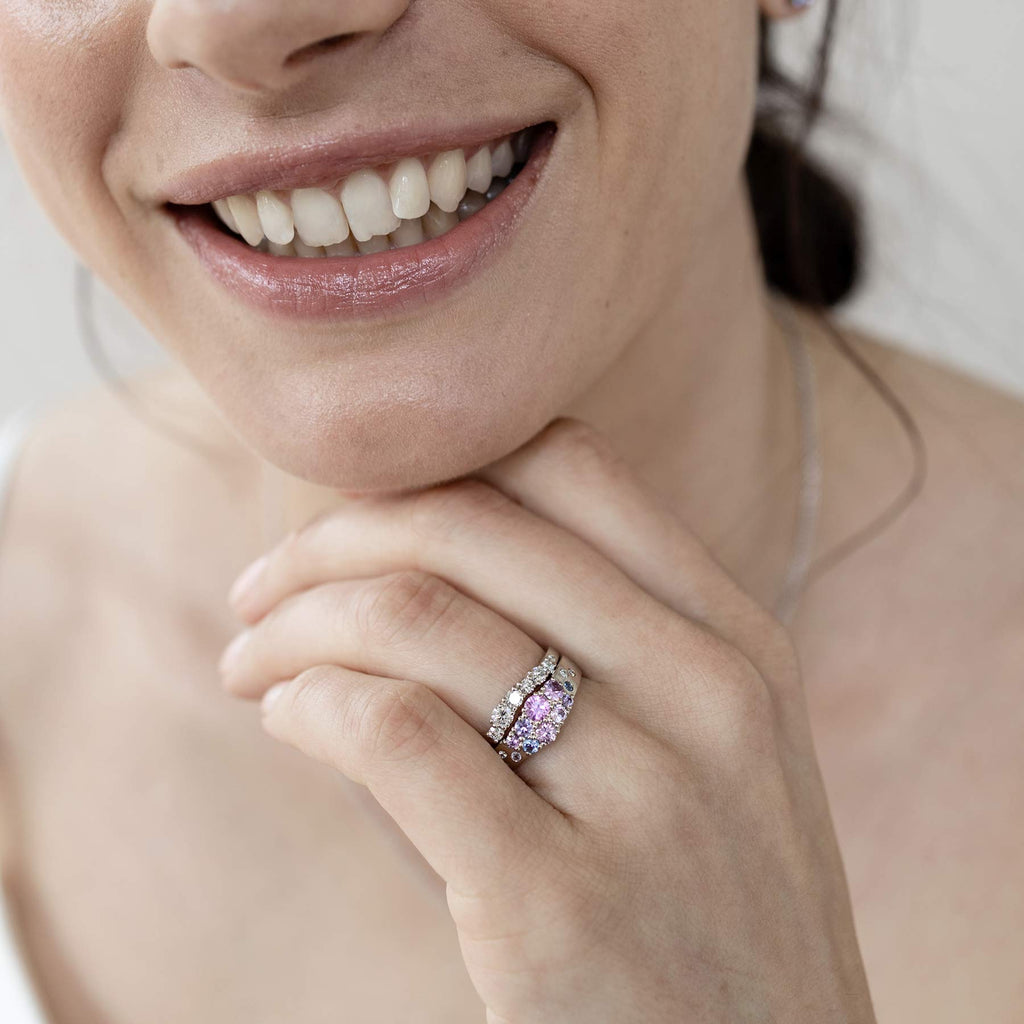 Keto Meadow Arc diamond ring with Keto Meadow narrowing pink ring on a woman's finger. Design by Jussi Louesalmi, Au3 Goldsmiths