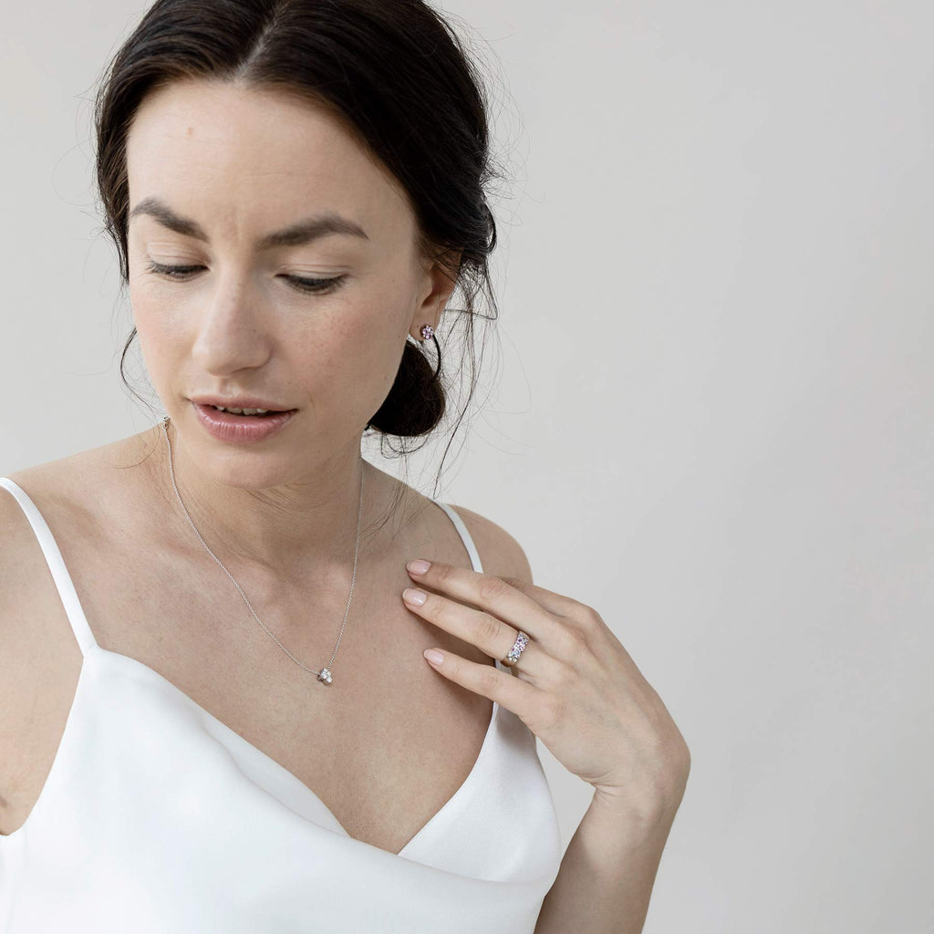 Model wearing a Keto Meadow necklace which has 4 different size white diamonds. Design Jussi Louesalmi, Au3 Goldsmiths.