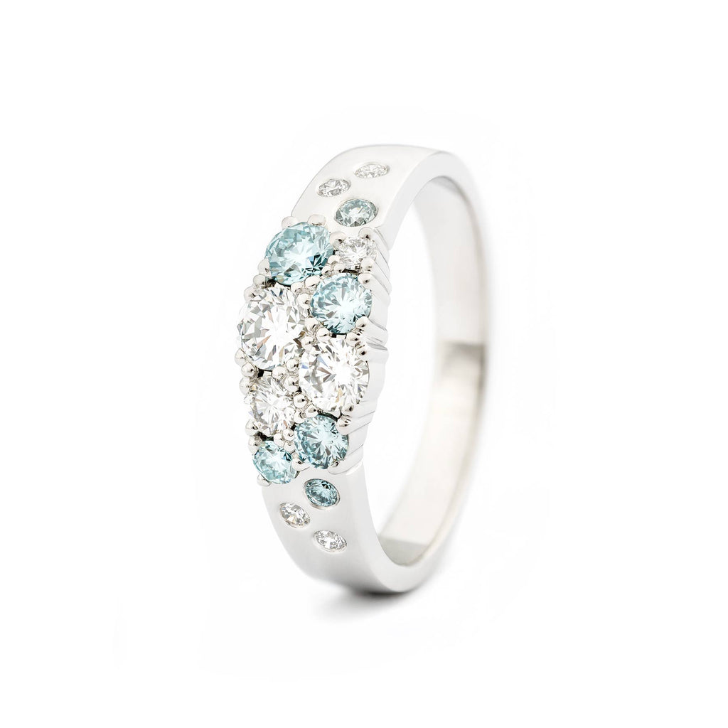 Turquoise Ice Blue diamonds and white tw/vs diamonds in the Keto Meadow ring by goldsmith Jussi Louesalmi, Au3 Goldsmiths