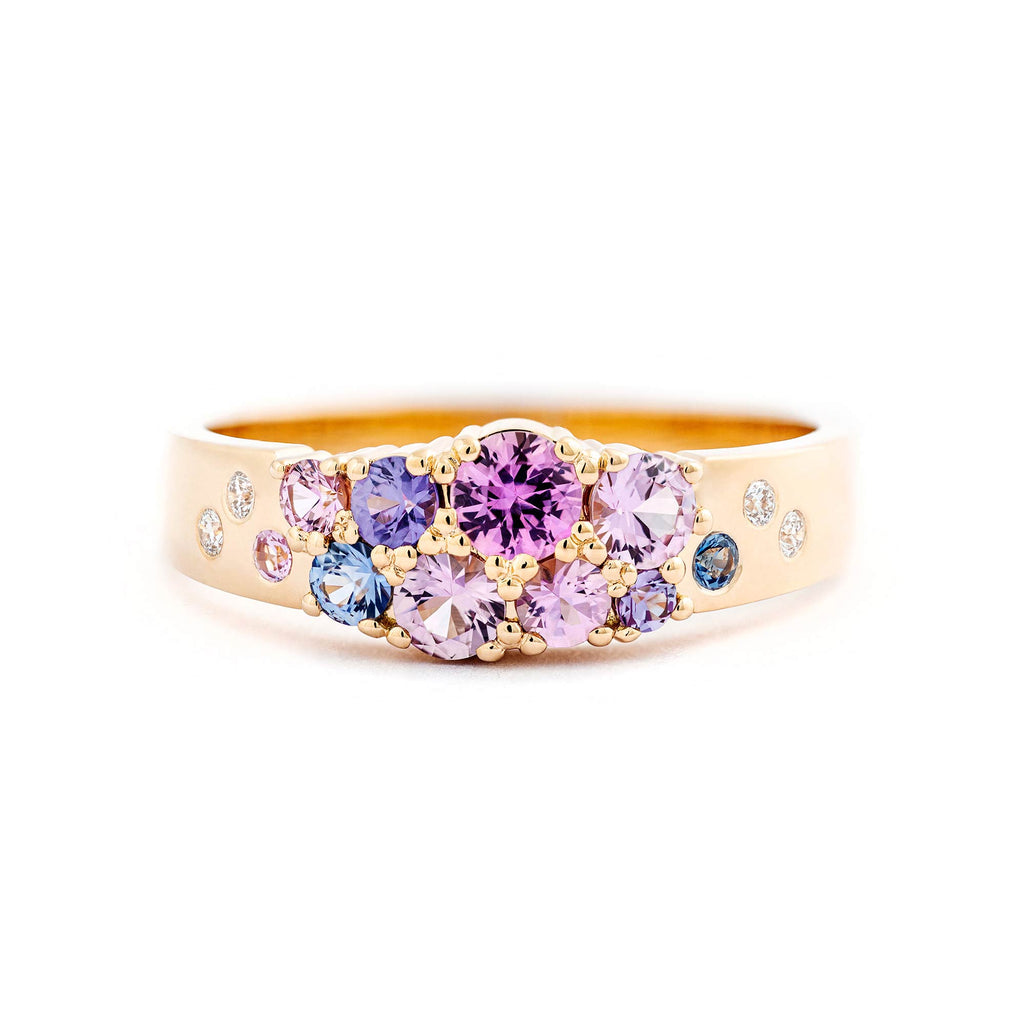 Floral feeling in the Keto Meadow narrowing ring with pink, blue and violet sapphires and white diamonds. The ring is made in 750 yellow gold. Design by Jussi Louesalmi, Au3 Goldsmiths.