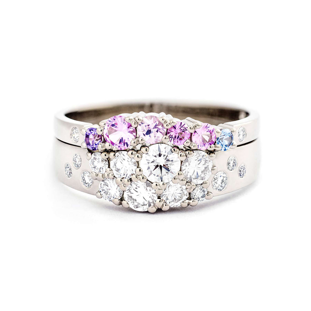 Keto Meadow narrowing ring with white diamonds, together with Keto Meadow Arc Pink ring with colorful sapphires and white diamonds. Beautiful combination! Design by Jussi Louesalmi, Au3 Goldsmiths