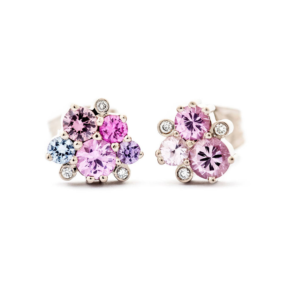 Pair of different model Keto Meadow stud earrings with pink, blue, and violet sapphires and white diamonds. Design by Jussi Louesalmi, Au3 Goldsmiths.