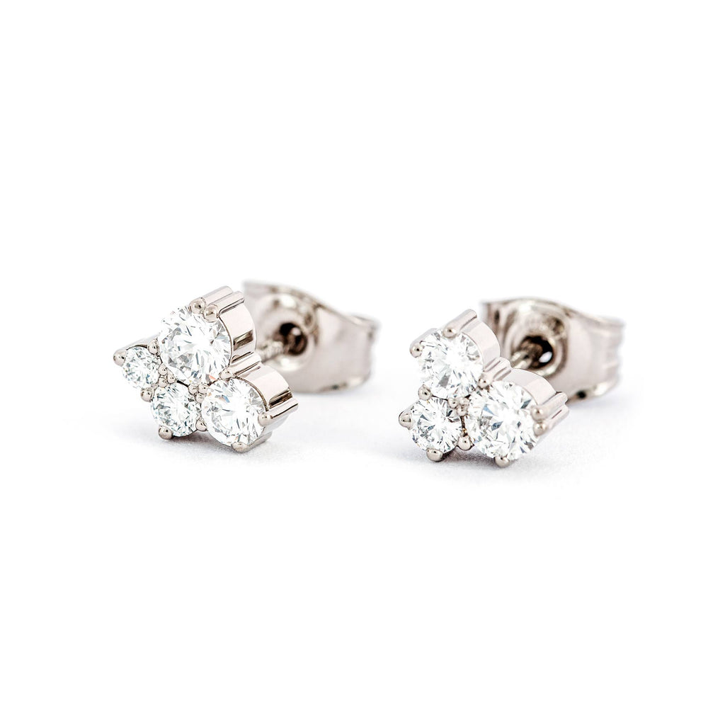 Keto Meadow stud earrings with 4 and 3 white diamonds each. Design by Jussi Louesalmi, Au3 Goldsmiths.