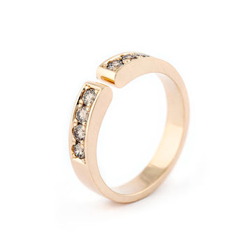 Modern Lilja ring with 8 brown diamonds. Design by Anu Kaartinen.