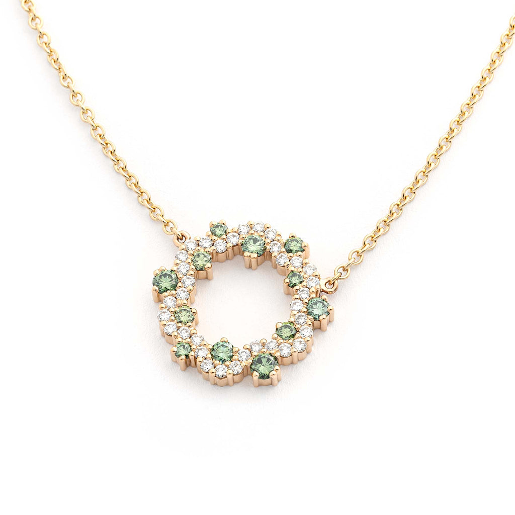 A golden MyWay circle necklace with white diamonds and Apple green diamonds. Design by Jussi Louesalmi, Au3 Goldsmiths