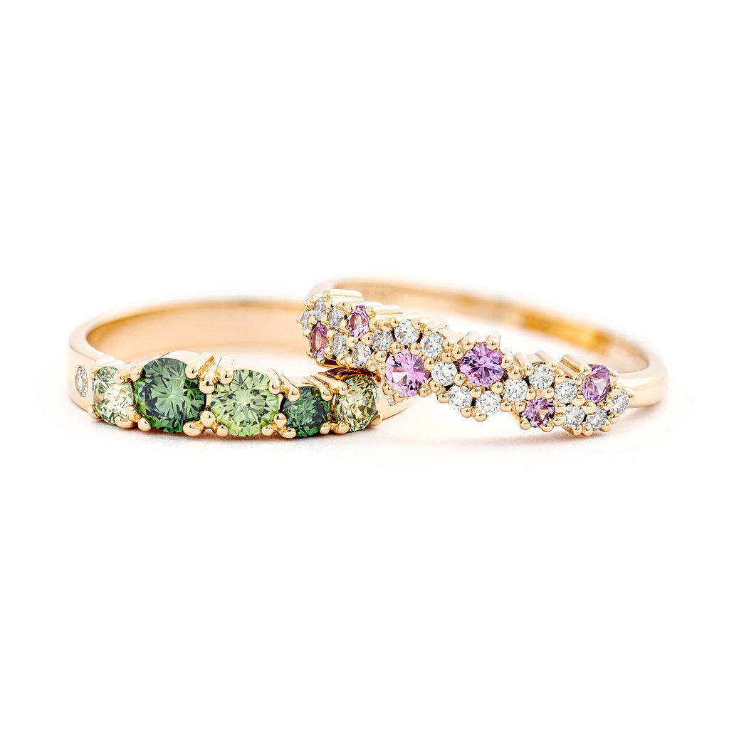 Keto Meadow ring with treated color green diamonds and white diamonds, together with MyWay diamond ring with pink sapphires and white diamonds. Both rings in 750 yellow gold. Design by Jussi Louesalmi, Au3 Goldsmiths.
